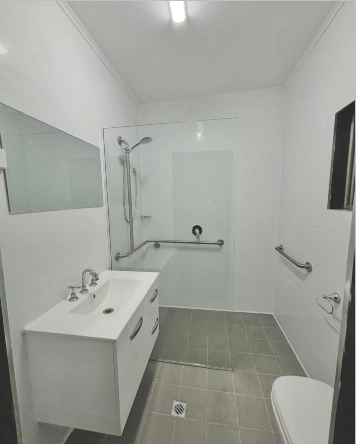 Completed accessible bathroom renovation with walk-in shower in Tumut